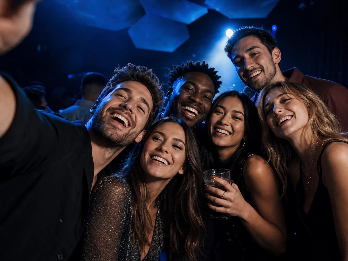 Event guests taking a group selfie at a celebration