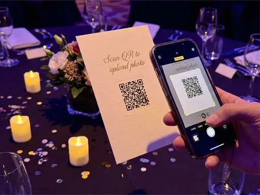 Guest scanning an event QR code with a phone camera